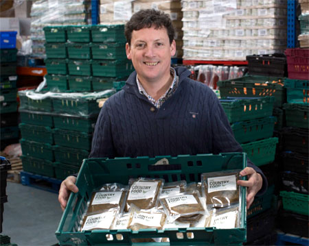 Chief Executive Tim Woodward gets the Country Casserole ready for distribution from FareShare in Bristol